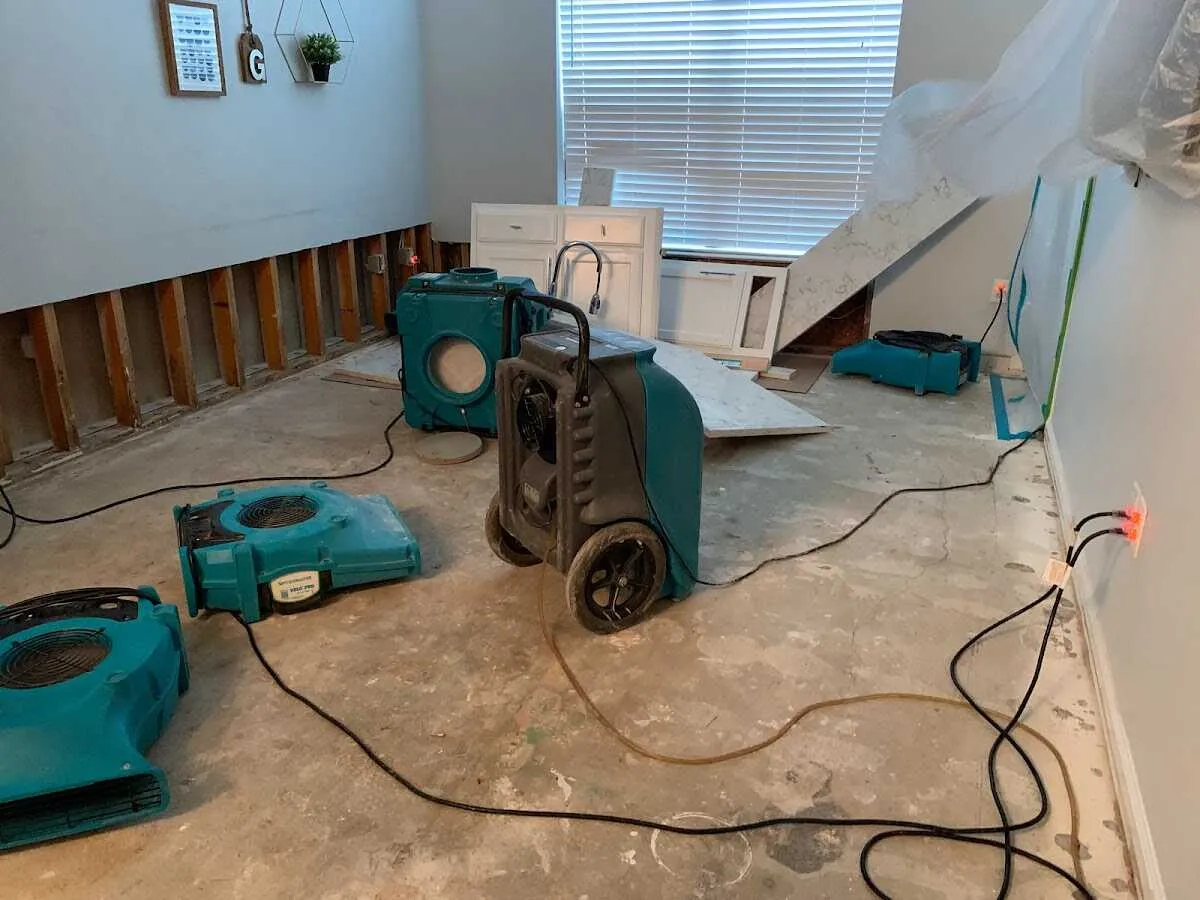 Dehumidifier in flood-cut room for Water Damage Restoration in Trinity
